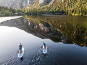 2vsup paddlers on a calm lake